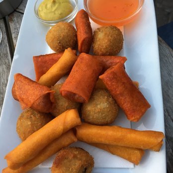 Café Het Molenpad - Appetizer-Deep Fried Cheese Sticks (long yellow), Fried Spicy Meat Spring Rolls (shorter orange), & Appetizer Croquettes (round) - Gastropubs Near Me - Amsterdam, New Hampshire Café Het Molenpad - Appetizer-Deep Fried Cheese Sticks (long yellow), Fried Spicy Meat Spring Rolls (shorter orange), & Appetizer Croquettes (round) - Gastropubs Near Me - Amsterdam, New Hampshire