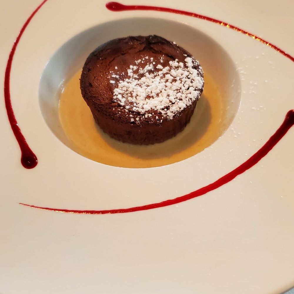 Bleu Provence - Chocolate lava cake with a hazelnut crème anglaise - French Near Me - Naples, Florida