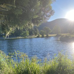 Hat Creek Hereford Ranch RV Park & Campground - Fully stocked trout pond at sunset!