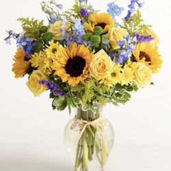 Conroy's Flowers Bakersfield - This is what was ordered.......this purple and blue flowers and yellow roses. Nothing like what I got.