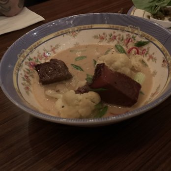 Eem - Sorry took the picture after we already grabbed some because we were so hungry.  Amazing white curry. - Cocktail Bars Near Me - Portland, Oregon
