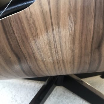 Design Within Reach - Chair one.  Big fade mark on wood frame.  Numerous scratches on feet of chair and ottoman. - Interior Design Near Me - Costa Mesa, California
