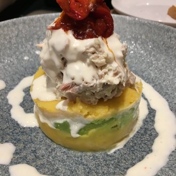 Pisco Y Nazca - Stacked chicken salad atop layers of whipped potatoes and avocado! - Gastropubs Near Me - Kendall, Florida