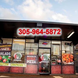 Exterior outside entrance of New York Roma Pizza - Drive they pizza place - Miami, Florida Exterior outside entrance of New York Roma Pizza - Drive they pizza place - Miami, Florida