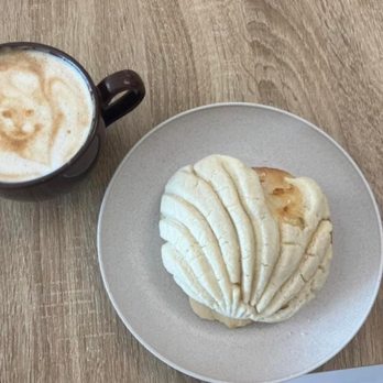 Pan Pan - Vanilla concha and pan pan latte love the art on the coffee - Bakeries Near Me - Pantego, Texas Pan Pan - Vanilla concha and pan pan latte love the art on the coffee - Bakeries Near Me - Pantego, Texas