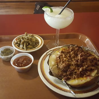 Texas Pit Stop BBQ - Chopped beef loaded potato with a margarita and green beans - Barbeque Near Me - La Marque, Texas Texas Pit Stop BBQ - Chopped beef loaded potato with a margarita and green beans - Barbeque Near Me - La Marque, Texas
