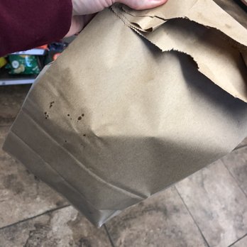 Branch Grocery & Bait - a person holding a brown paper bag - Grocery Near Me - Princeton, Texas