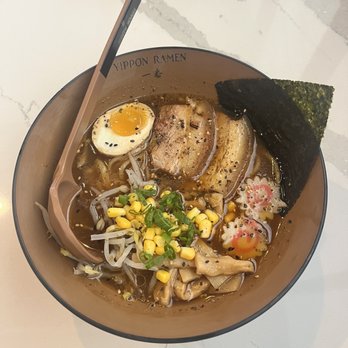 Yippon Ramen - Black Garlic Ramen with soft boiled egg, fish cake, nori (seaweed), corn, bamboo shoots, scallions (green onion). - Sushi Bars Near Me - San Antonio, Texas Yippon Ramen - Black Garlic Ramen with soft boiled egg, fish cake, nori (seaweed), corn, bamboo shoots, scallions (green onion). - Sushi Bars Near Me - San Antonio, Texas
