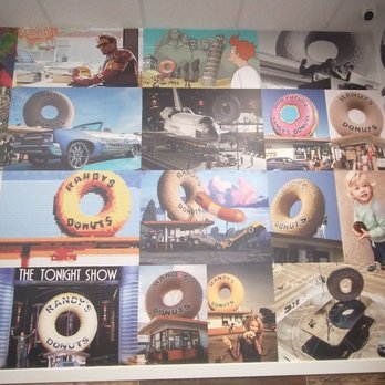 Randy’s Donuts - More of the "mural". Loving the race car doing the donut around the building. - Coffee & Tea Near Me - San Diego, California