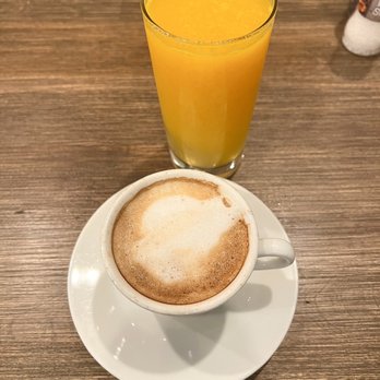 Famous Toastery - a glass of orange juice and a cup of cappuccino - Breakfast & Brunch Near Me - Ashburn, Virginia Famous Toastery - a glass of orange juice and a cup of cappuccino - Breakfast & Brunch Near Me - Ashburn, Virginia