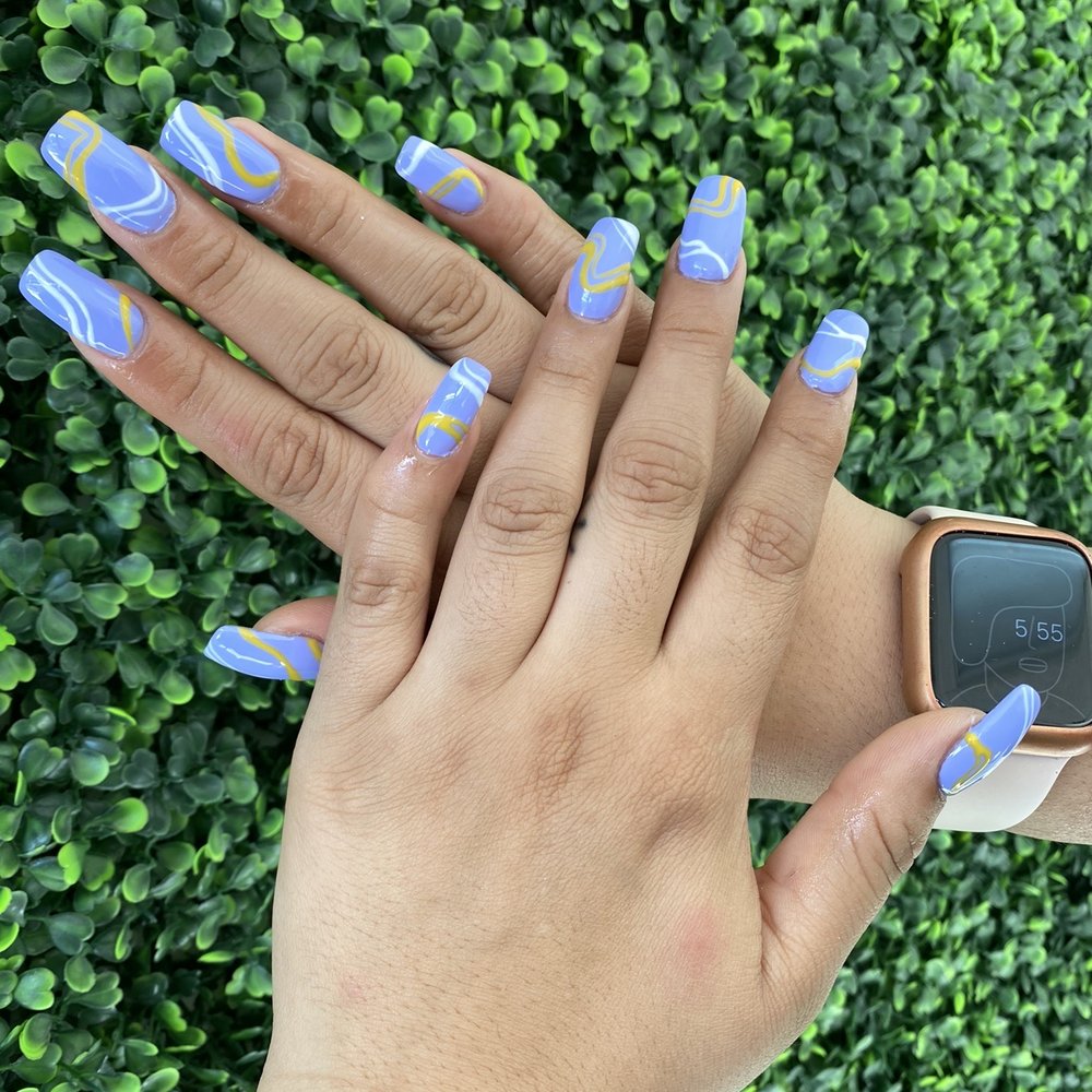 Delaray Nails - Lavender nails with white and yellow designs by Angela - Nail Salons Near Me - Miami, Florida