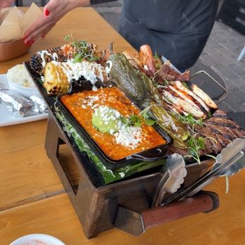 Carmelita’s - Dana Point - La Parrillada (steak, al pastor, chicken, shrimp, corn, jalapeño, onion, cheese dip, and fresh tortillas), Potato Taquitos Con Salsa Roja - Mexican Near Me - Dana Point, California Carmelita’s - Dana Point - La Parrillada (steak, al pastor, chicken, shrimp, corn, jalapeño, onion, cheese dip, and fresh tortillas), Potato Taquitos Con Salsa Roja - Mexican Near Me - Dana Point, California