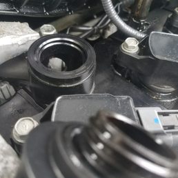 Picture of hole in valve cover caused by attendant filling with oil during oil change. Picture of hole in valve cover caused by attendant filling with oil during oil change.