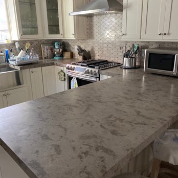 Stone Impressions - a kitchen counter with a microwave and oven - General Contractors Near Me - Brooklyn, New York Stone Impressions - a kitchen counter with a microwave and oven - General Contractors Near Me - Brooklyn, New York