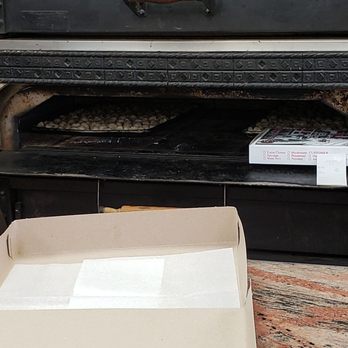 Knapp Pizza II - a pizza oven with a pizza in it - Pizza Near Me - Brooklyn, New York