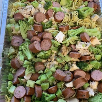Creative Soul Food Kitchen - a tray of broccoli and sausage - Personal Chefs Near Me Creative Soul Food Kitchen - a tray of broccoli and sausage - Personal Chefs Near Me