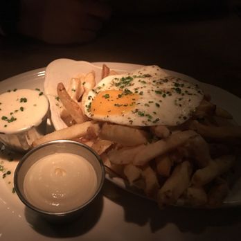 Au Cheval - Crispy fries with mornay sauce, garlic aioli, & fried farm egg - Bars Near Me - Chicago, Illinois Au Cheval - Crispy fries with mornay sauce, garlic aioli, & fried farm egg - Bars Near Me - Chicago, Illinois
