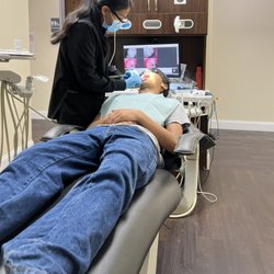 Arc 32 Family Dentistry - Hygienist cleaning teeth. She was very nice.