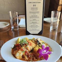 The Cork Tucson - June is SEAFOOD month during our Summer Getaway. Corvina is similar to Sea Bass. Sauteed with onions, tomatoes, lemon & beurre blanc