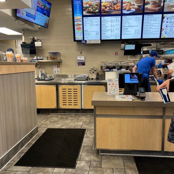 Culver's - a man standing at a counter in a fast food restaurant - Fast Food Near Me - Yulee, Florida