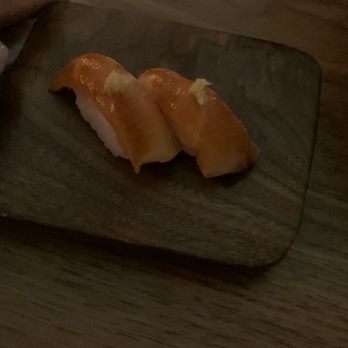 Uchi Austin - Sake Toro with ginger on top....must eat right away with your hands place in mouth upside down - Sushi Bars Near Me - Austin, Texas Uchi Austin - Sake Toro with ginger on top....must eat right away with your hands place in mouth upside down - Sushi Bars Near Me - Austin, Texas