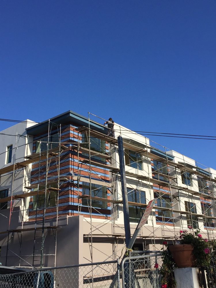 Slide of Titan Roofing & Rain Gutters Inc.