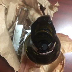 Abiy's International Wines & Liquor - This is what I got after walking out of the store. Cheap bags. Poorly wrapped. Owner did nothing to make it right.
