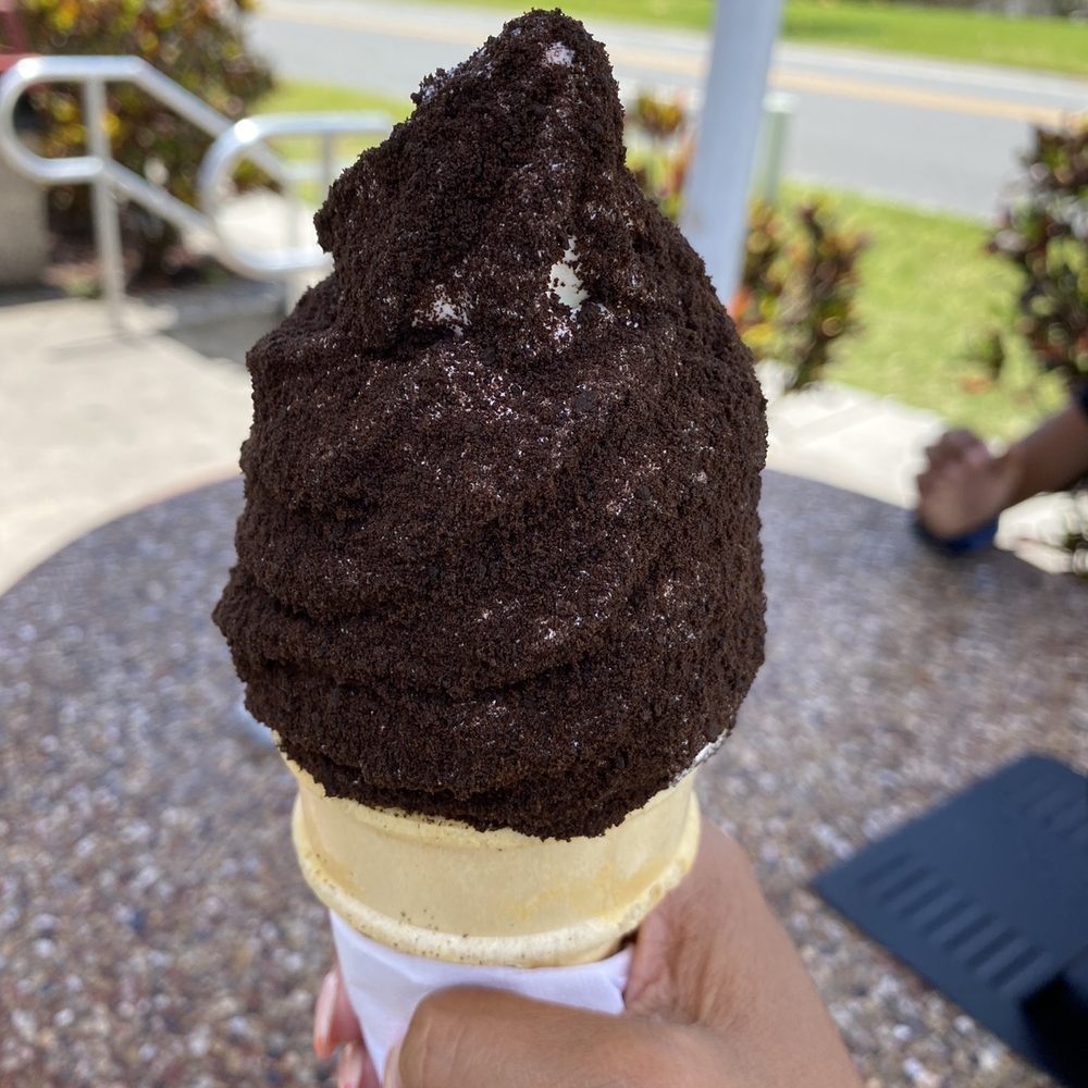 Vanilla and Strawberry Swirl Soft-serve with Oreo Cookie crumble on a cake cone Vanilla and Strawberry Swirl Soft-serve with Oreo Cookie crumble on a cake cone