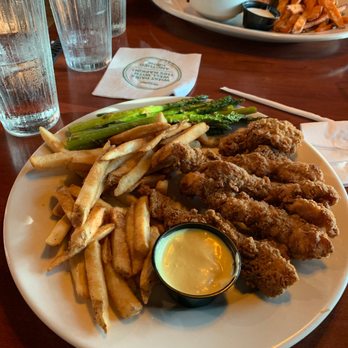 O'Charley's Restaurant & Bar - Chicken tenders, fries, and asparagus. - American Near Me - Cincinnati, Ohio O'Charley's Restaurant & Bar - Chicken tenders, fries, and asparagus. - American Near Me - Cincinnati, Ohio