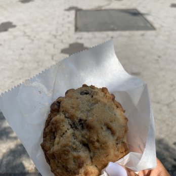 Levain Bakery - Upper East Side, NYC - There's a park nearby perfect for cookie eating. Sunny and nice. - Bakeries Near Me - New York, New York