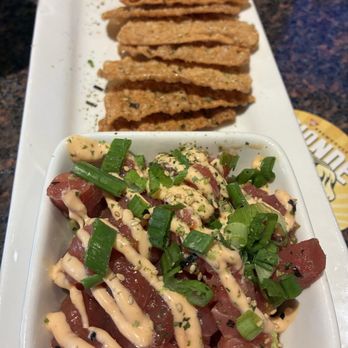 BJ's Restaurant & Brewhouse - Tuna tartare over guacamole served with fried wonton wrappers - New American Near Me - Orlando, Florida BJ's Restaurant & Brewhouse - Tuna tartare over guacamole served with fried wonton wrappers - New American Near Me - Orlando, Florida