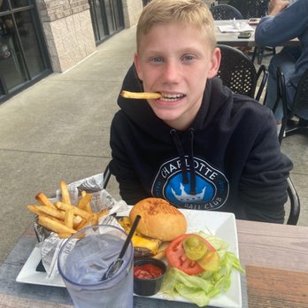 Jekyll and Hyde Taphouse Grill - Brody and his classic burger with fries - Bars Near Me - Matthews, North Carolina Jekyll and Hyde Taphouse Grill - Brody and his classic burger with fries - Bars Near Me - Matthews, North Carolina