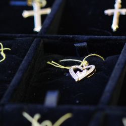 Champion Pawn and Jewelry - Gold and silver pendants.