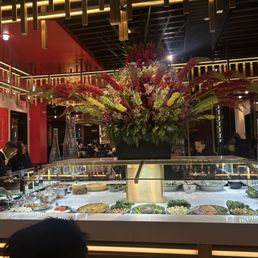 Main buffet area with flower arrangement Main buffet area with flower arrangement