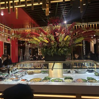 Texas de Brazil - Cincinnati - Main buffet area with flower arrangement - Brazilian Near Me - Cincinnati, Ohio Texas de Brazil - Cincinnati - Main buffet area with flower arrangement - Brazilian Near Me - Cincinnati, Ohio