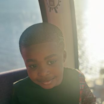 The Capital Wheel - My youngest son aboard the Capital wheel with the sun reflecting off the water in the background. - Amusement Parks Near Me - National Harbor, Maryland The Capital Wheel - My youngest son aboard the Capital wheel with the sun reflecting off the water in the background. - Amusement Parks Near Me - National Harbor, Maryland