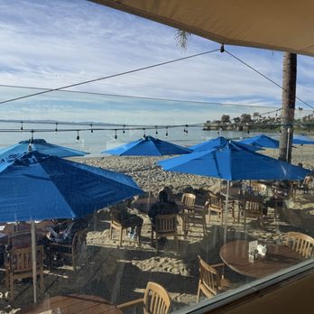 Shoreline Cafe - Beach table scene. Dip the toes... watch the waves. - Seafood Near Me - Santa Barbara, California