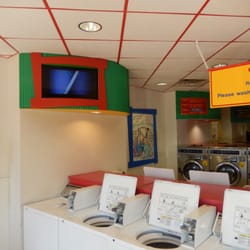 Laundromania - TV and top load washing machines