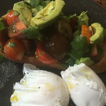 Roasting Warehouse - Avocado and cherry tomatoes on toast with poached eggs - Coffee Roasteries Near Me - North Melbourne, VIC Roasting Warehouse - Avocado and cherry tomatoes on toast with poached eggs - Coffee Roasteries Near Me - North Melbourne, VIC