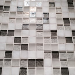 a closeup of a mosaic tile wall