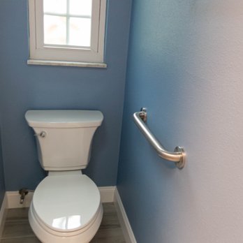 JTG Construction - Toilet with handicapped grip - General Contractors Near Me