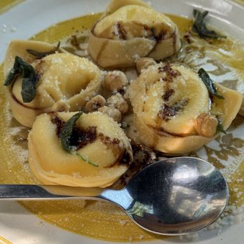 Tortello - Tortelli filled with burrata in a sage butter sauce with roasted hazelnuts and balsamic reduction - Pasta Shops Near Me - Chicago, Illinois Tortello - Tortelli filled with burrata in a sage butter sauce with roasted hazelnuts and balsamic reduction - Pasta Shops Near Me - Chicago, Illinois