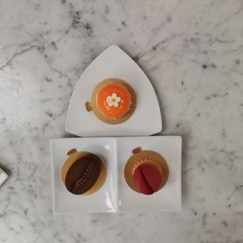 Jonquils Cafe & Bakery - Honey pear, tulip, and coffee bean cakes in clockwise order (starting from 12 o'clock position). - Cafes Near Me - Boston, Massachusetts