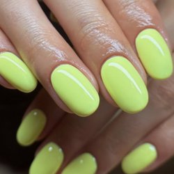 Nail Bar & Spa - These nails are a bold and trendy neon yellow with a high-gloss gel finish -- perfect for summer vibes and making a statement