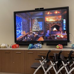 Encino Branch Library - Jazz music being played on the screen with a faux fireplace in a Christmas setting, LOL! That's the spirit!!