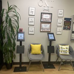 Childcare Network - A cozy and inviting lobby, complete with comfortable seating and a colorful bulletin board showcasing heartwarming moments fr...