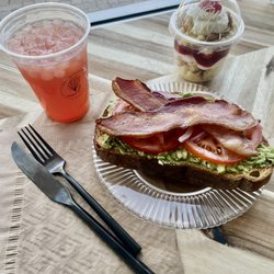 The Little Piggy Avocado Toast - thick country white bread with bacon jam, avocado, tomato, red onion & thick sliced bacon