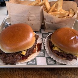 Double burger with bacon and fries. Double burger with bacon and fries.
