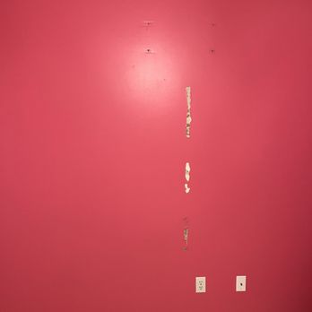 Paint Pros - Bedroom wall repairs and changed wall color from hot pink to grey - Painters Near Me