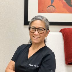 Emily Lou, Osteopathic Manual Practitioner, PT - In the treatment room